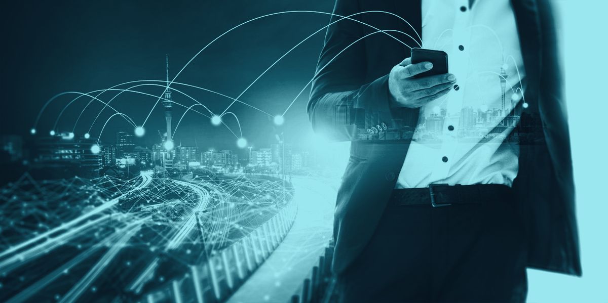 A businessman on a phone call with streaks of light behind him